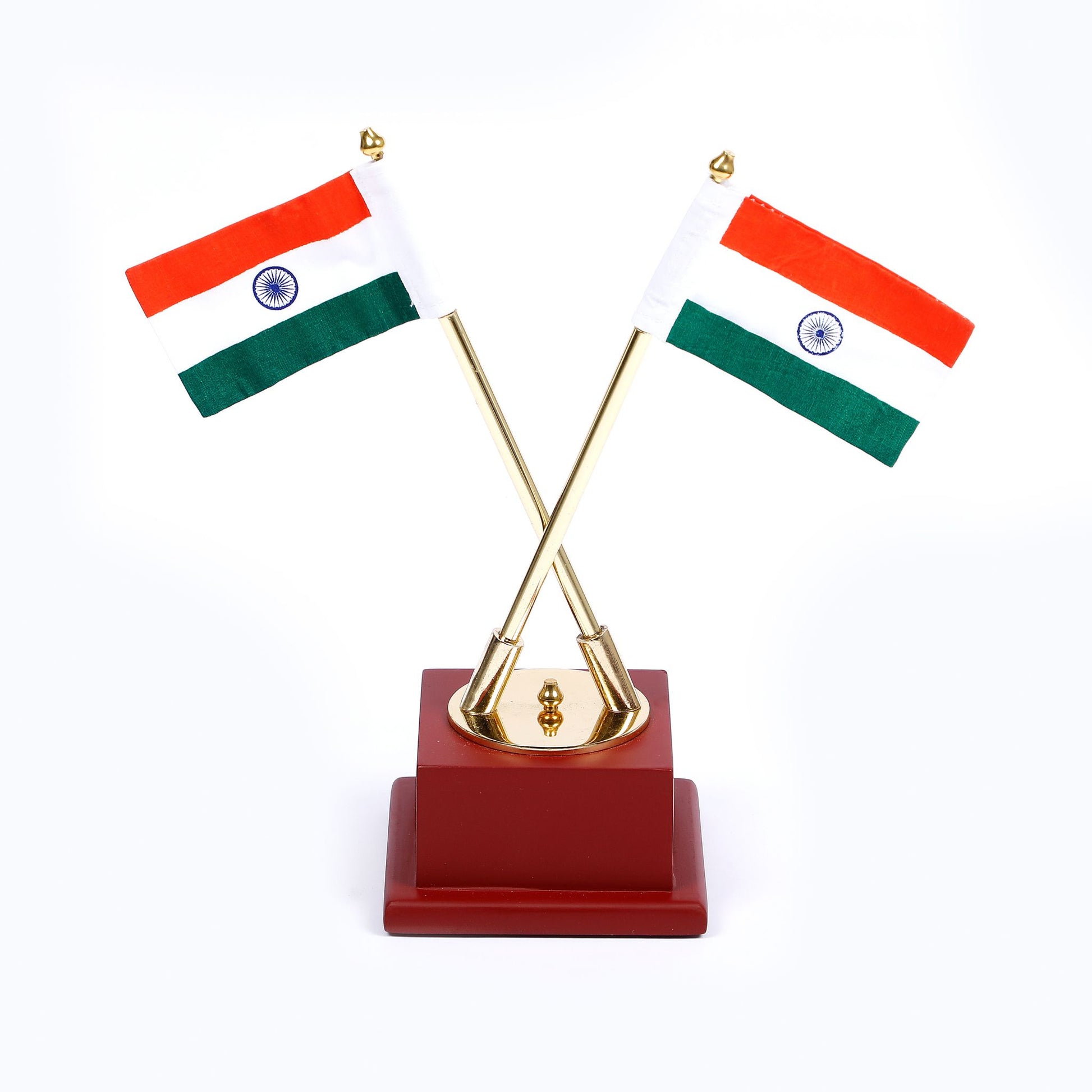 A table top Indian national flag with a gold-plated metal rod and a wooden base, featuring two small Indian flags.