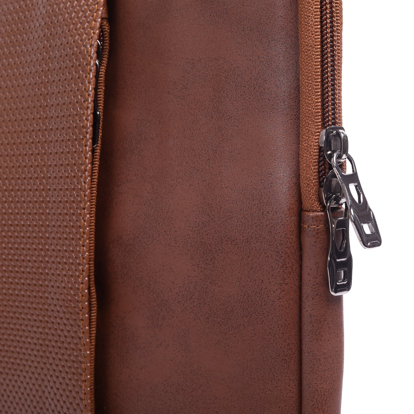 Close-up of a brown leather bag with a zipper