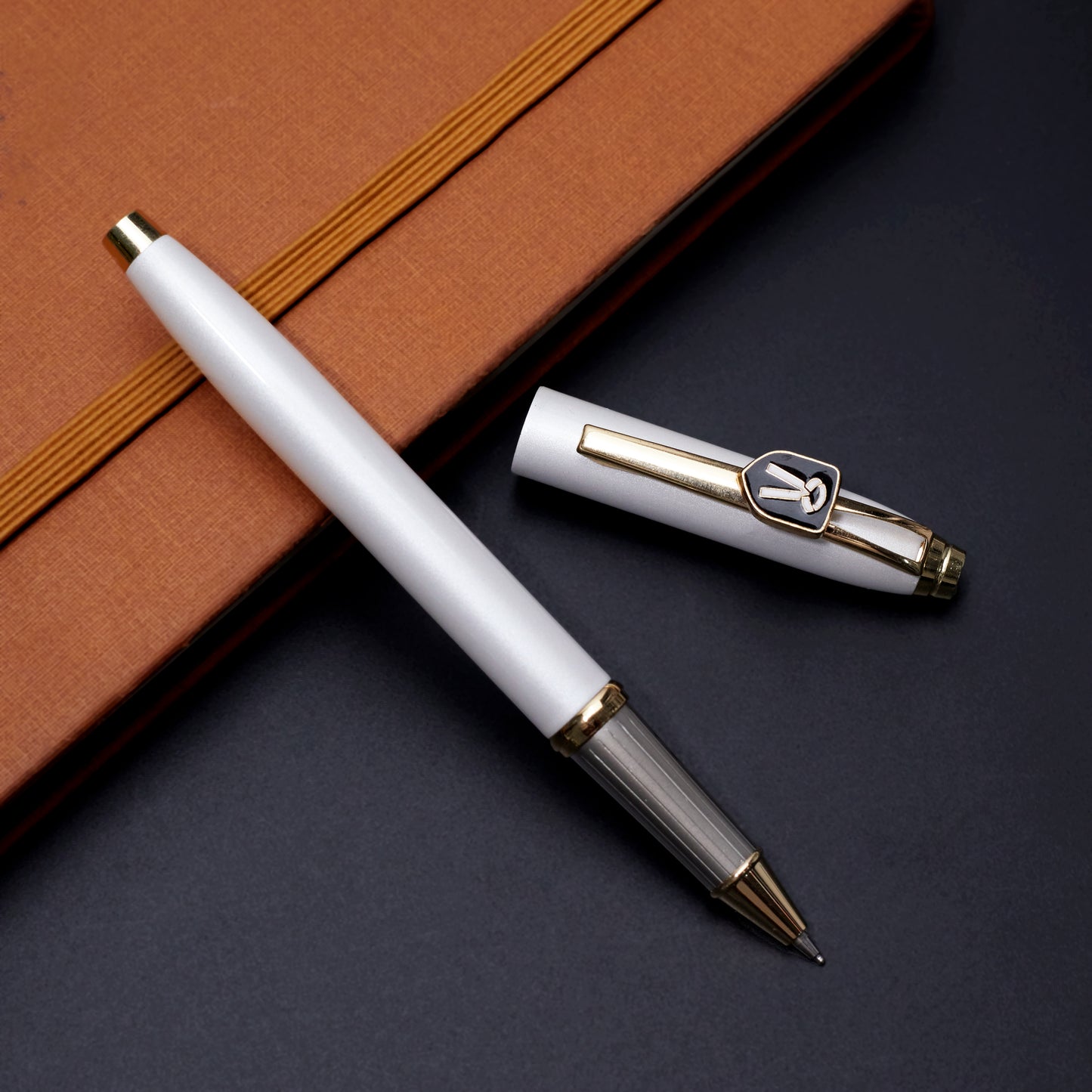 Refillable ballpoint pen with metallic finish