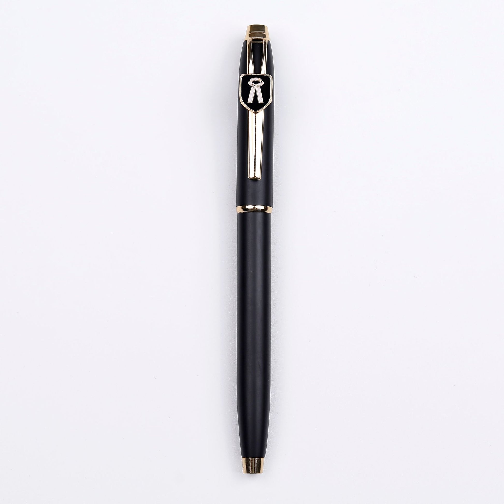 A black and gold ball pen with the brand symbol on the top, set against a white background.