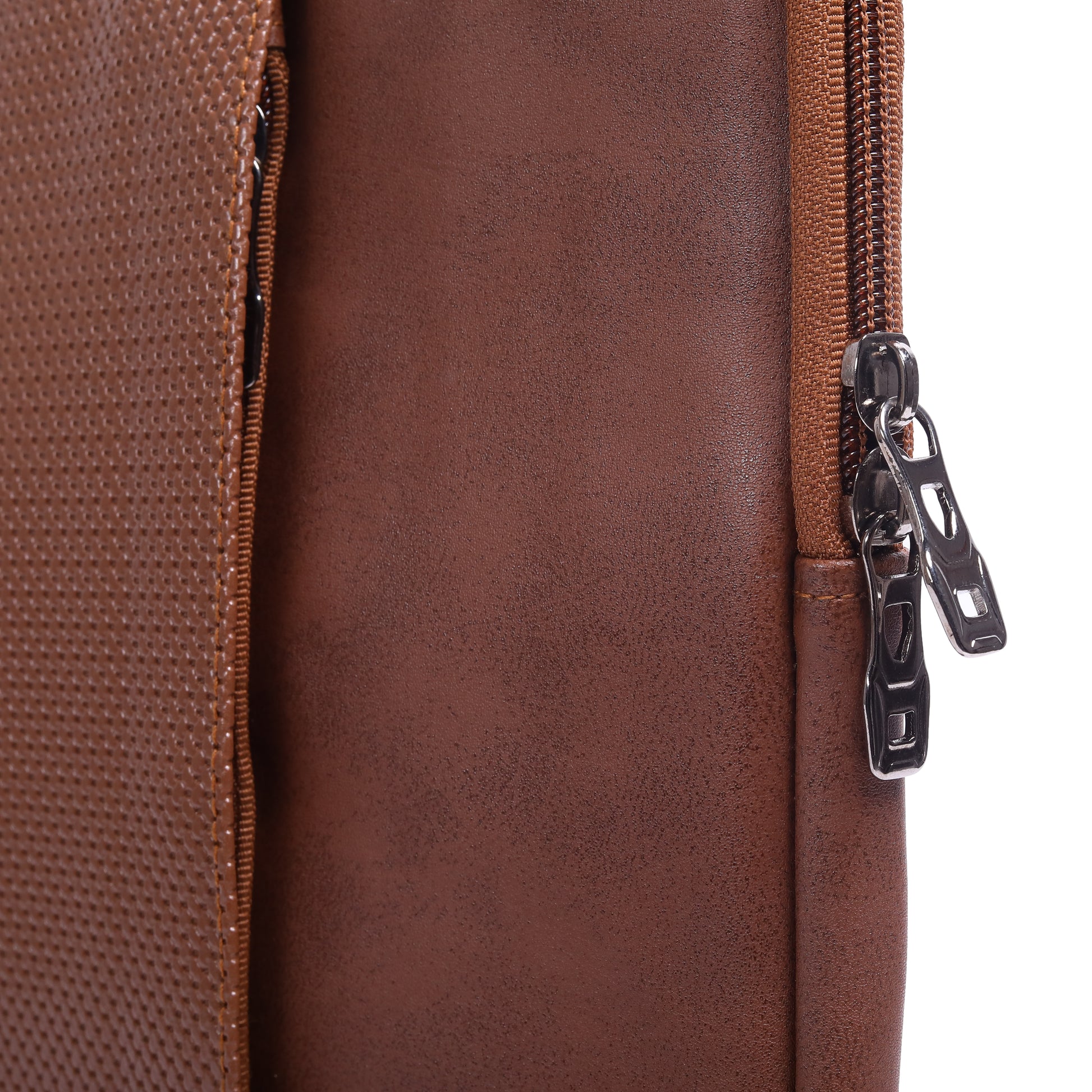 Close-up of a brown leather bag with a zipper