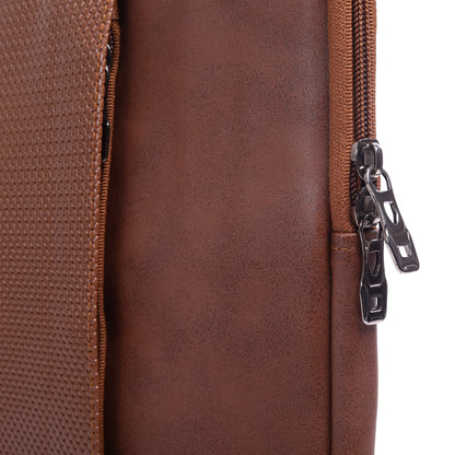 Close-up of a brown leather bag with a zipper
